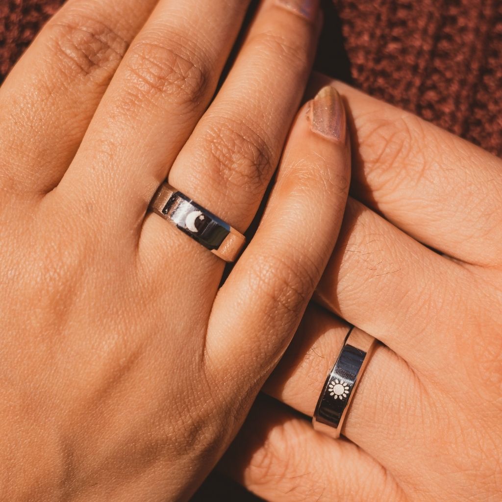 Black Band Matching Couple Moon and Sun Promise Ring set showcasing elegant sun and moon designs on durable black bands.