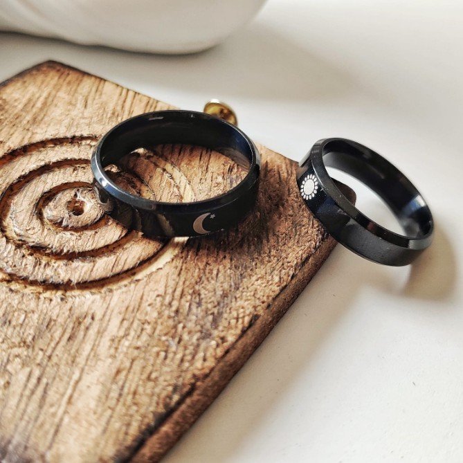 Black Band Matching Couple Moon and Sun Promise Ring set showcasing elegant sun and moon designs on durable black bands.
