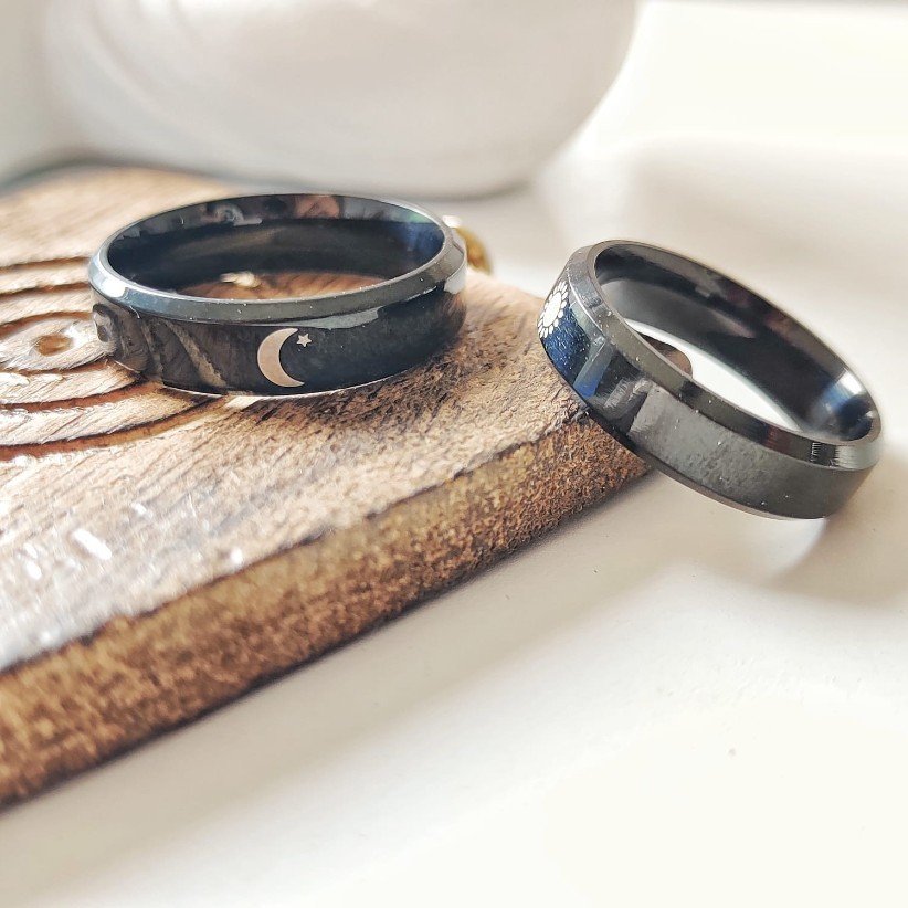 Black Band Matching Couple Moon and Sun Promise Ring set showcasing elegant sun and moon designs on durable black bands.