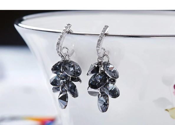 Elegant black dangling cluster grapevine earrings made of 14K white gold plating, featuring circular black stones.