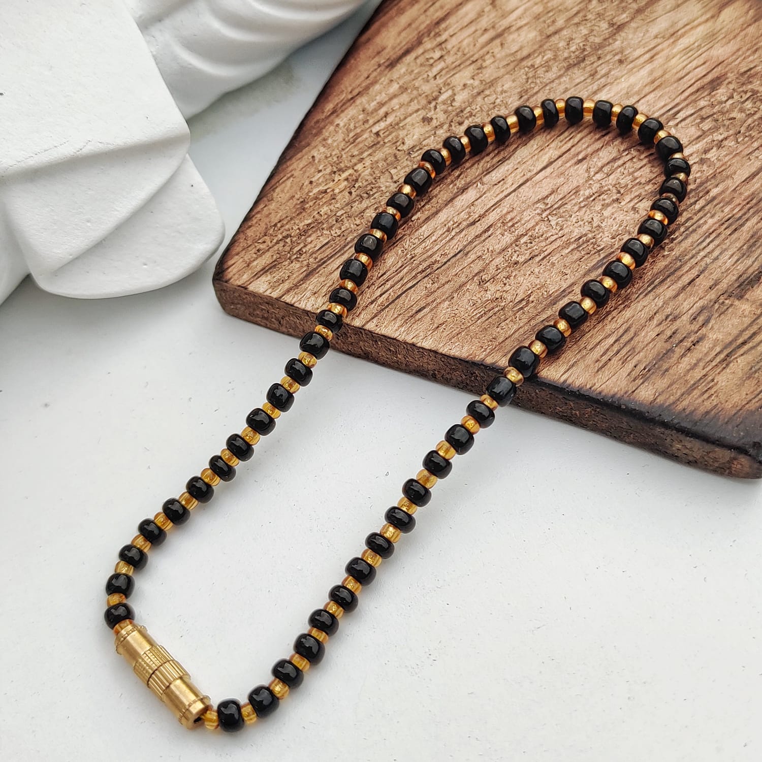 Black Golden Mangalsutra Tiny Black Bead bracelet for kids, featuring exquisite black beads and a golden thread design.