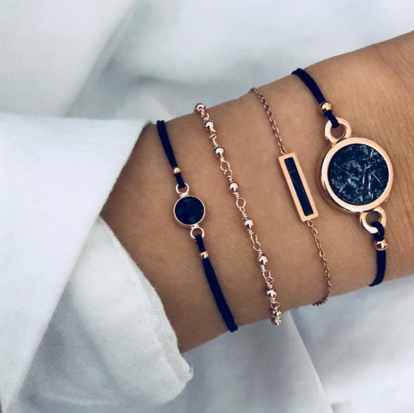 Black Lapis Marble Geometric 4 Piece Bracelet Set featuring 14K gold plating and unique geometric pendants, designed in Italy.
