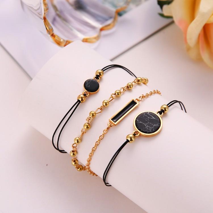 Black Lapis Marble Geometric 4 Piece Bracelet Set featuring 14K gold plating and unique geometric pendants, designed in Italy.