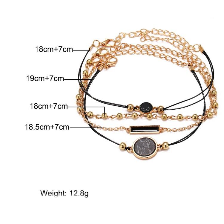 Black Lapis Marble Geometric 4 Piece Bracelet Set featuring 14K gold plating and unique geometric pendants, designed in Italy.