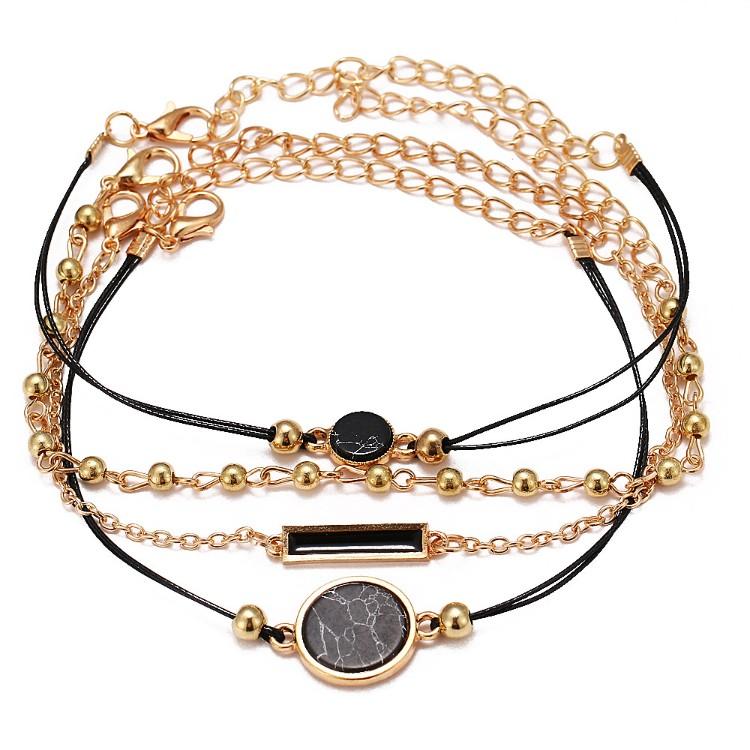 Black Lapis Marble Geometric 4 Piece Bracelet Set featuring 14K gold plating and unique geometric pendants, designed in Italy.