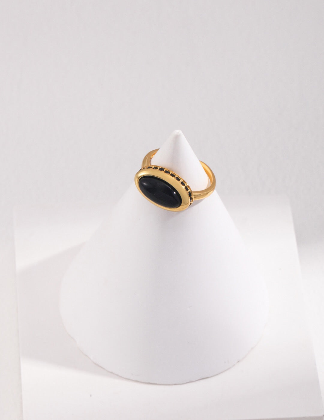 A stunning Black Onyx Oval Ring set in sterling silver with gold vermeil, showcasing its elegant design and craftsmanship.
