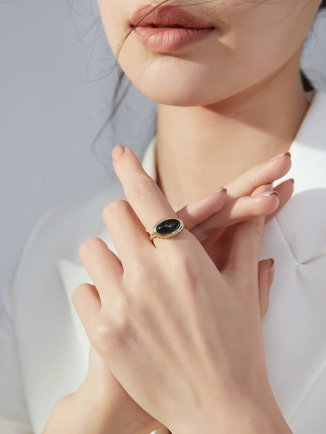 A stunning Black Onyx Oval Ring set in sterling silver with gold vermeil, showcasing its elegant design and craftsmanship.