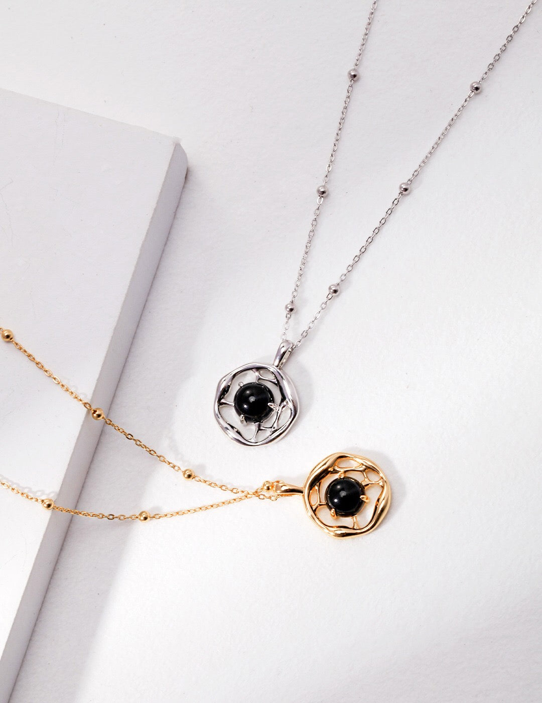 A beautifully handcrafted Black Onyx Pendant Necklace featuring a gold vermeil chain, showcasing a striking black onyx stone.