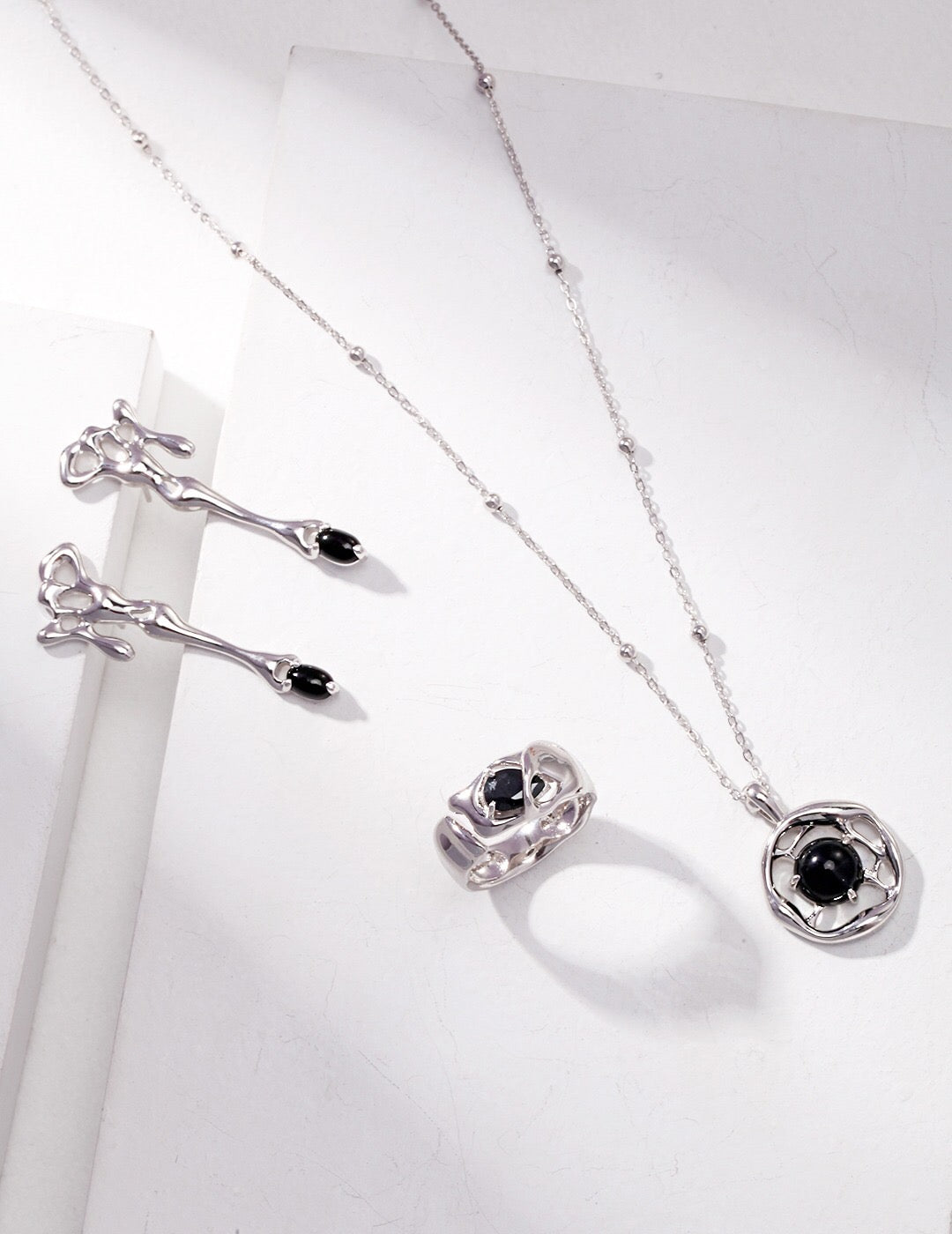 A beautifully handcrafted Black Onyx Pendant Necklace featuring a gold vermeil chain, showcasing a striking black onyx stone.