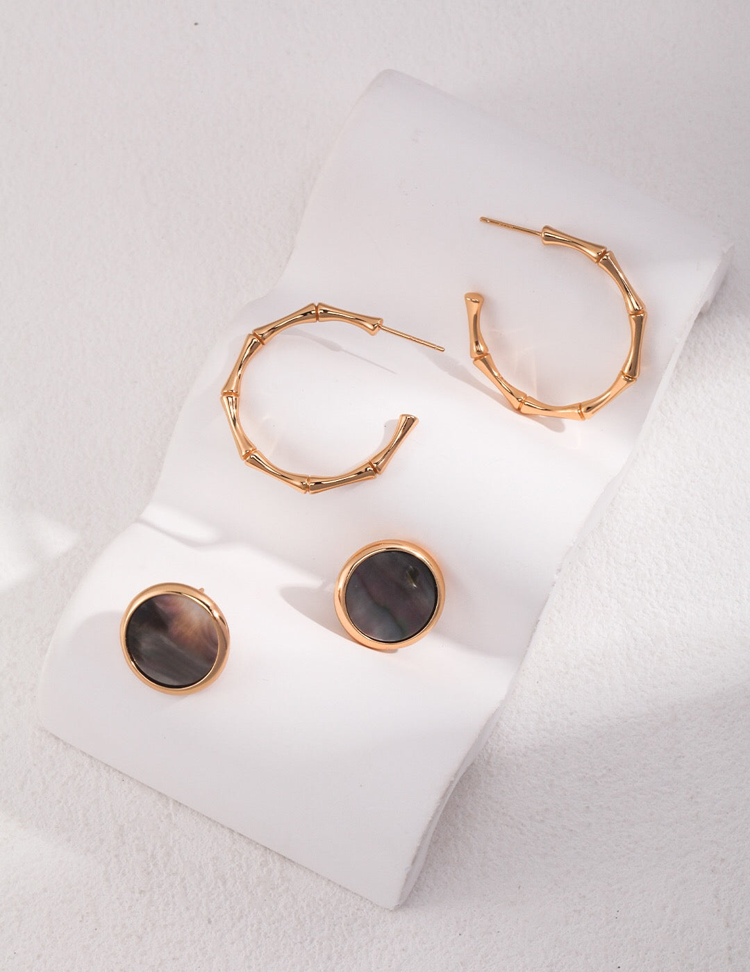 Elegant Black Shell Statement Stud earrings with gold vermeil finish, showcasing a unique handmade design.