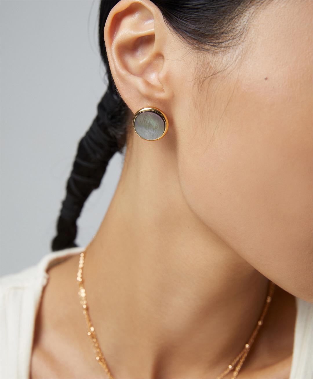 Elegant Black Shell Statement Stud earrings with gold vermeil finish, showcasing a unique handmade design.