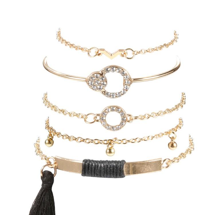 Elegant Black Tassel Pav'e 5 Piece Bracelet Set featuring 14K gold plating and white crystal accents, designed in Italy.
