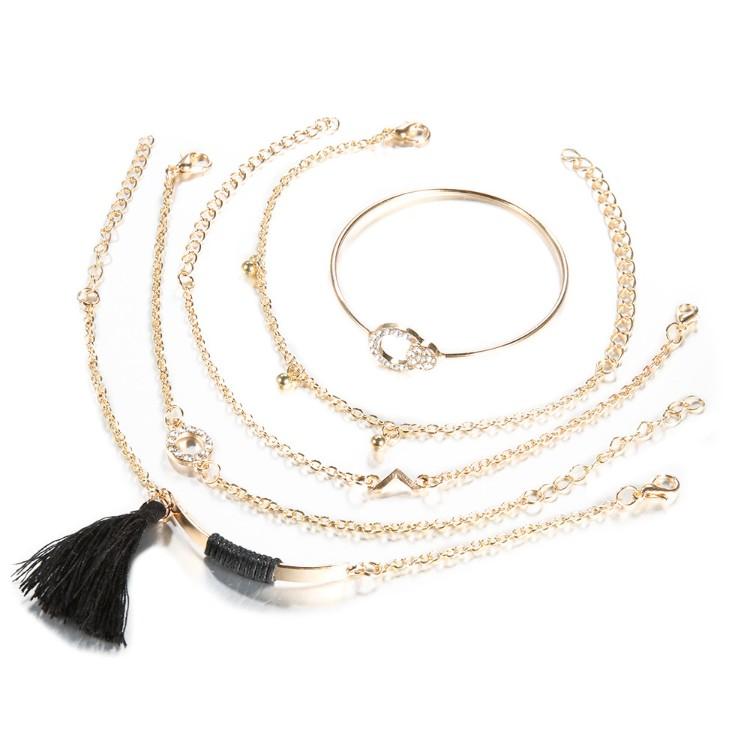 Elegant Black Tassel Pav'e 5 Piece Bracelet Set featuring 14K gold plating and white crystal accents, designed in Italy.