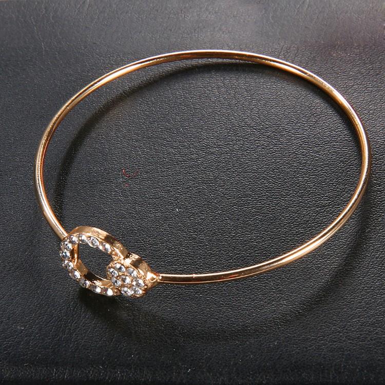 Elegant Black Tassel Pav'e 5 Piece Bracelet Set featuring 14K gold plating and white crystal accents, designed in Italy.