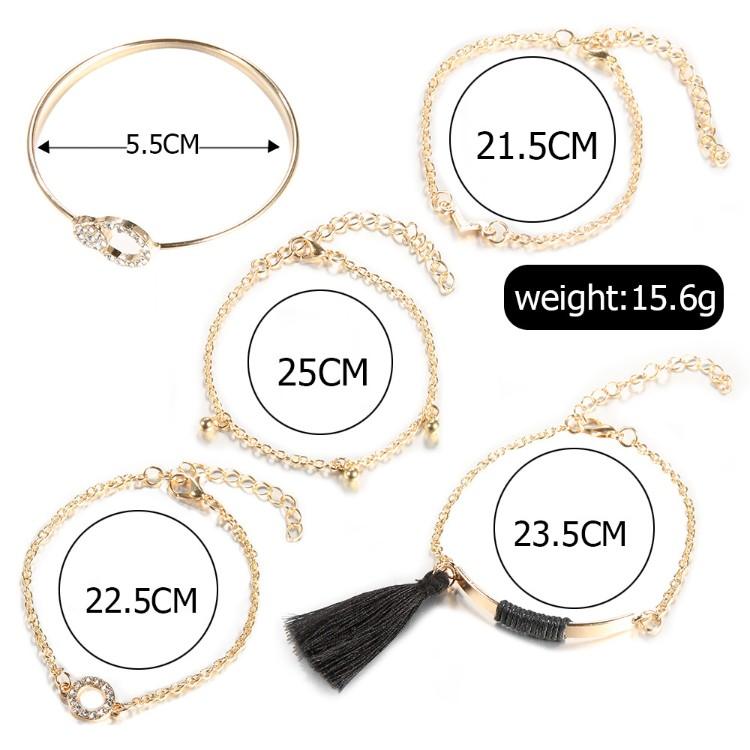 Elegant Black Tassel Pav'e 5 Piece Bracelet Set featuring 14K gold plating and white crystal accents, designed in Italy.