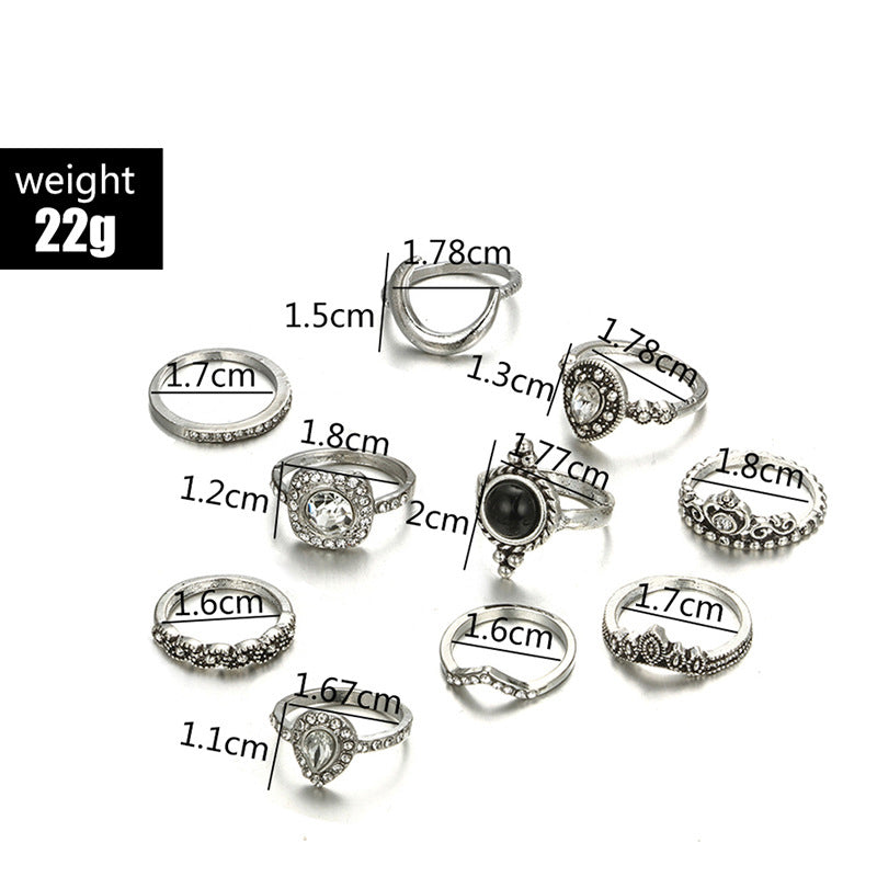 Black & White 11 Piece Bohemian Ring Set featuring 14K white gold plated brass and micro-Pav'e crystals, elegantly displayed.