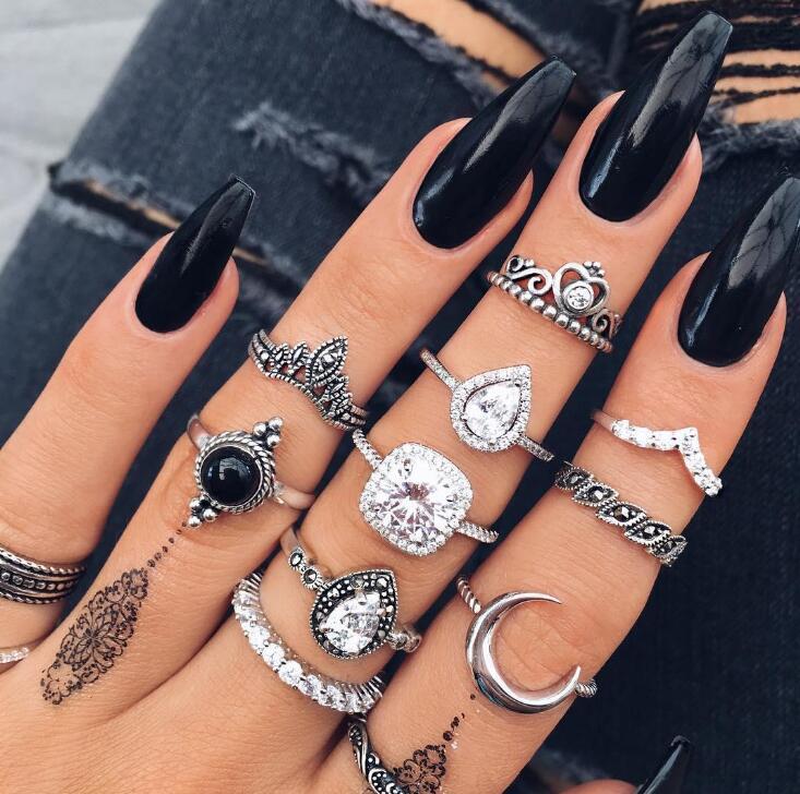 Black & White 11 Piece Bohemian Ring Set featuring 14K white gold plated brass and micro-Pav'e crystals, elegantly displayed.