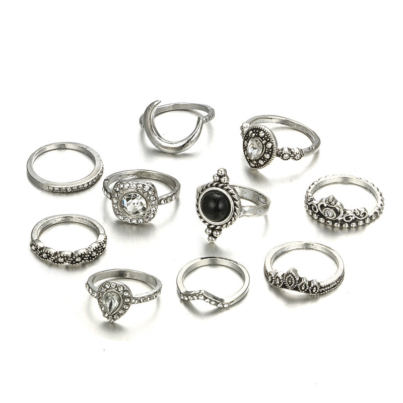 Black & White 11 Piece Bohemian Ring Set featuring 14K white gold plated brass and micro-Pav'e crystals, elegantly displayed.