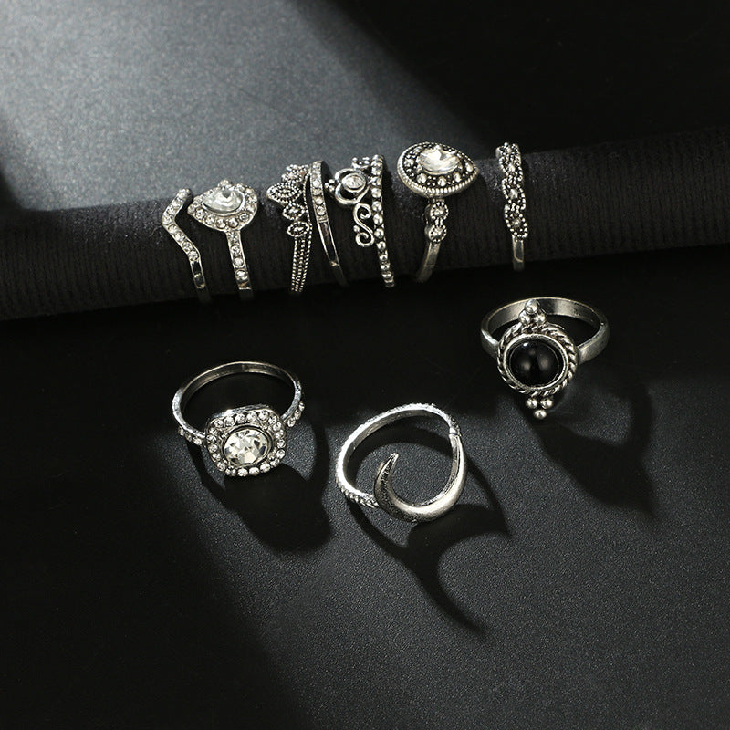 Black & White 11 Piece Bohemian Ring Set featuring 14K white gold plated brass and micro-Pav'e crystals, elegantly displayed.