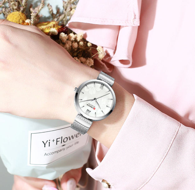 Blith women's watch I 551121 featuring a simple white dial and metal chain strap in pink and silver colors.