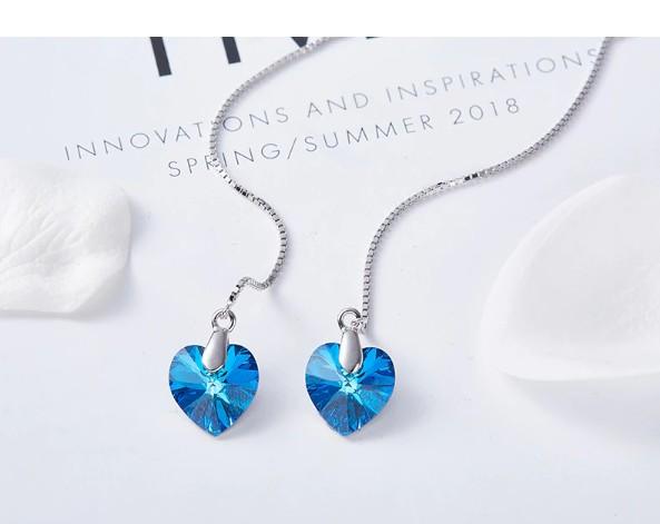 Elegant Blue Elements Dangling Heart Shaped Threader Earrings in 14K White Gold, showcasing vibrant blue stones and a delicate design.