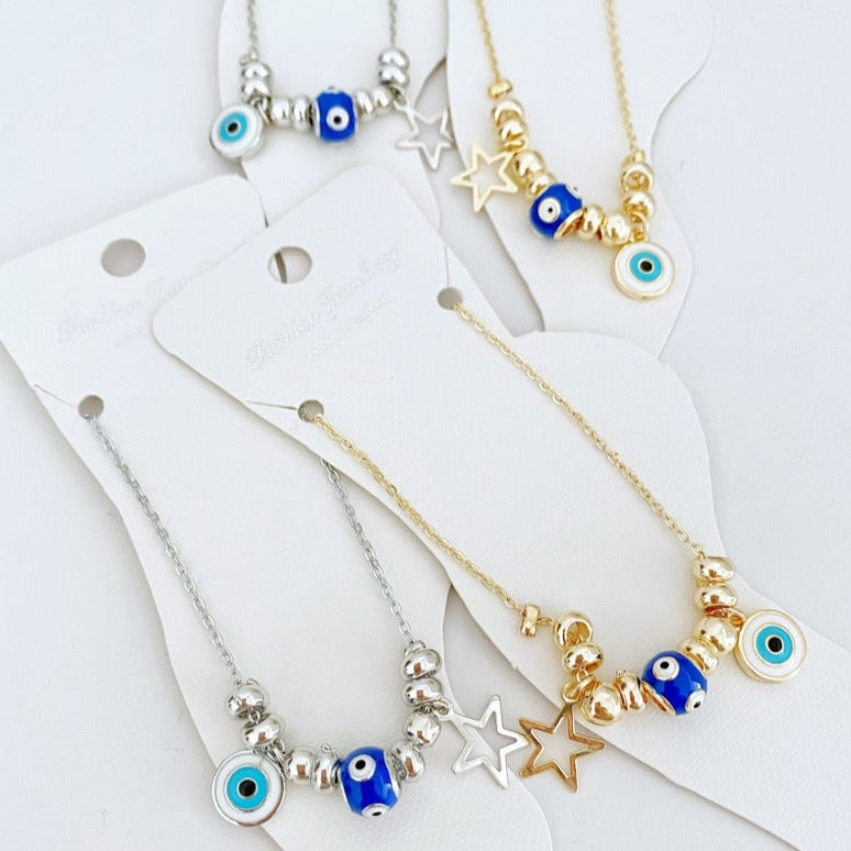 A stylish Blue Evil Eye Anklet featuring a blue evil eye charm and star charm, available in gold and silver finishes.