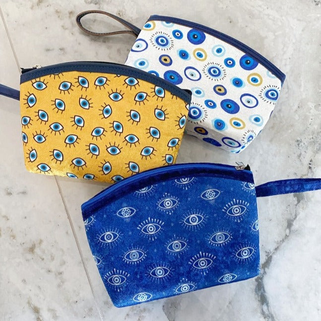 A stylish Blue Evil Eye Bag, handmade with high-quality cotton fabric, featuring a unique evil eye design, perfect for women.