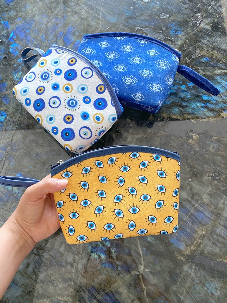 A stylish Blue Evil Eye Bag, handmade with high-quality cotton fabric, featuring a unique evil eye design, perfect for women.