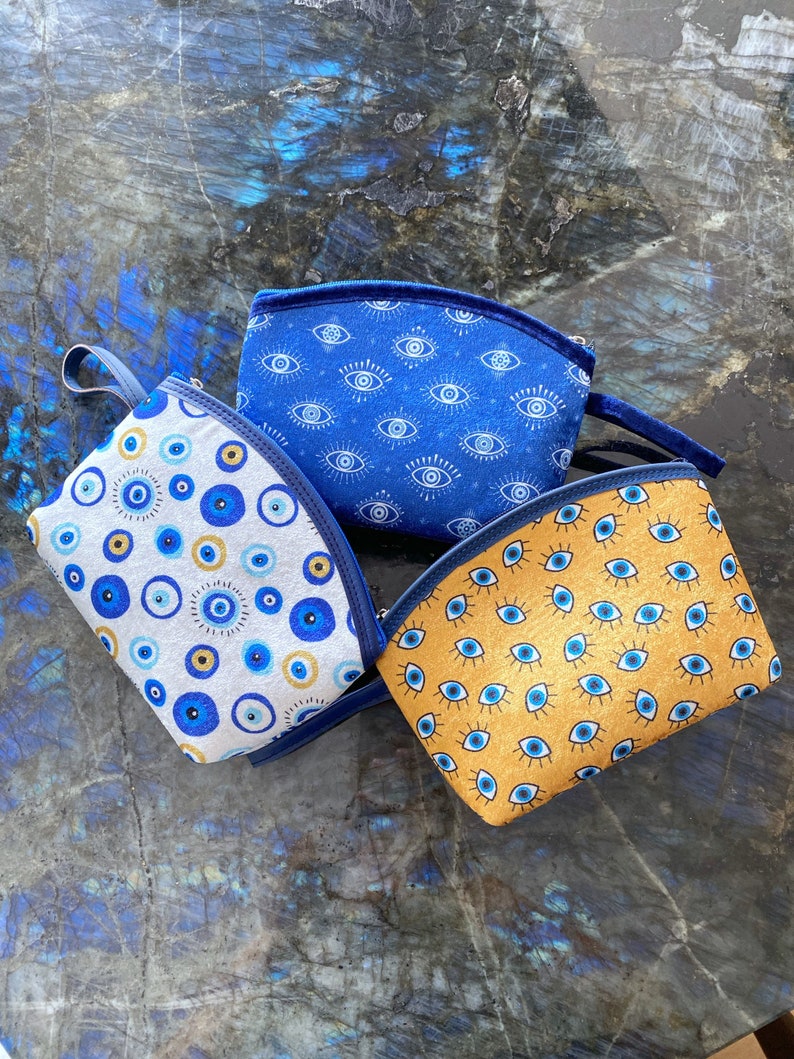 A stylish Blue Evil Eye Bag, handmade with high-quality cotton fabric, featuring a unique evil eye design, perfect for women.