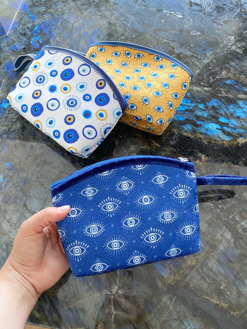 A stylish Blue Evil Eye Bag, handmade with high-quality cotton fabric, featuring a unique evil eye design, perfect for women.