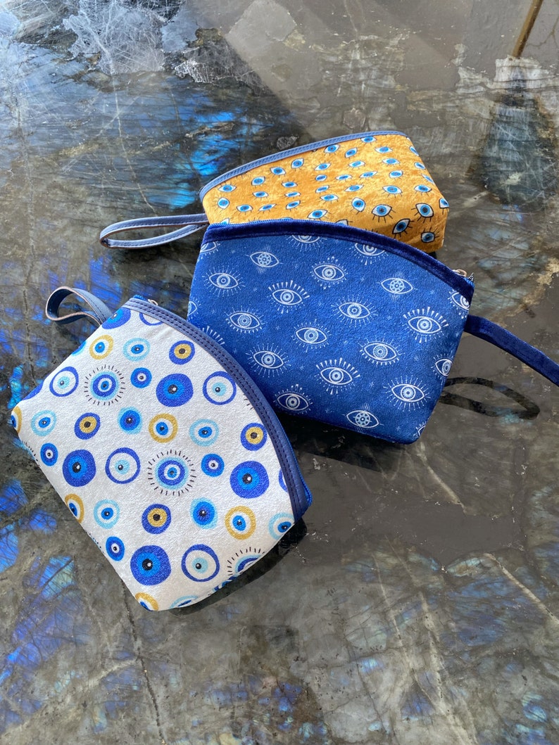 A stylish Blue Evil Eye Bag, handmade with high-quality cotton fabric, featuring a unique evil eye design, perfect for women.