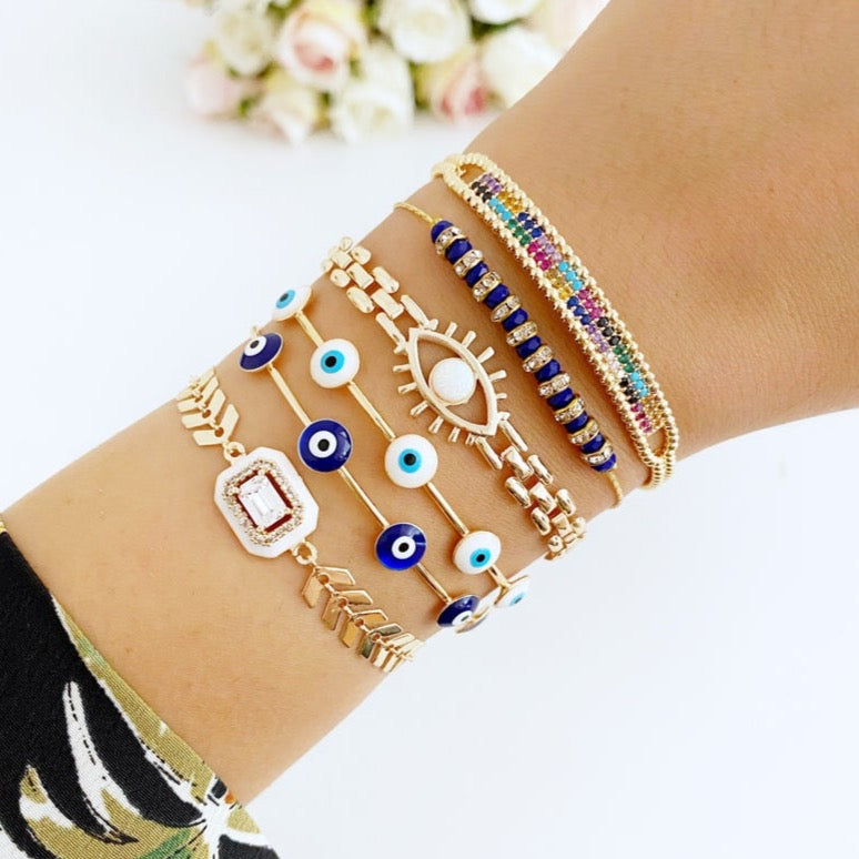 A beautiful Blue Evil Eye Bracelet featuring a gold chain and adjustable design, handmade with 316L stainless steel for durability.