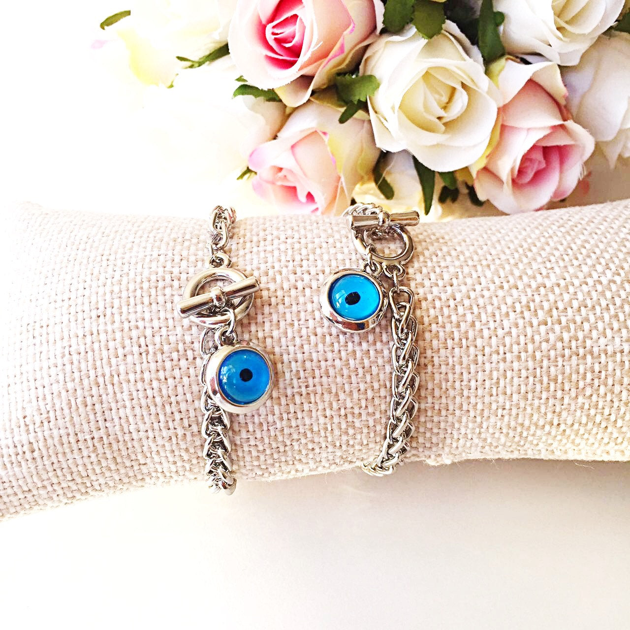 A handmade Blue Evil Eye Bracelet featuring a silver chain and a striking blue evil eye charm, symbolizing protection and good fortune.
