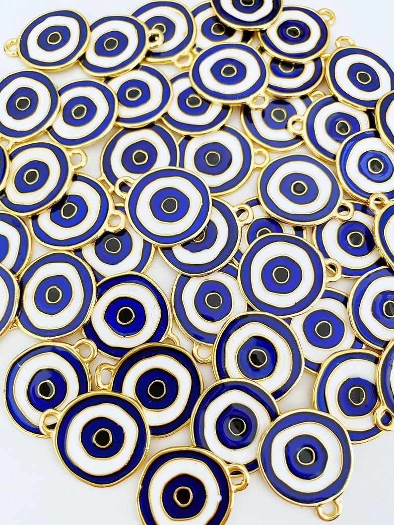 A beautiful blue evil eye charm made of brass, featuring gold plating, measuring 20mm, perfect for jewelry making.
