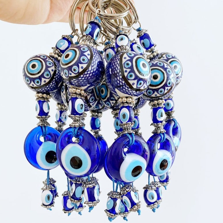 Blue Evil Eye Keychain featuring a ceramic ball charm and evil eye design, symbolizing protection and good luck.