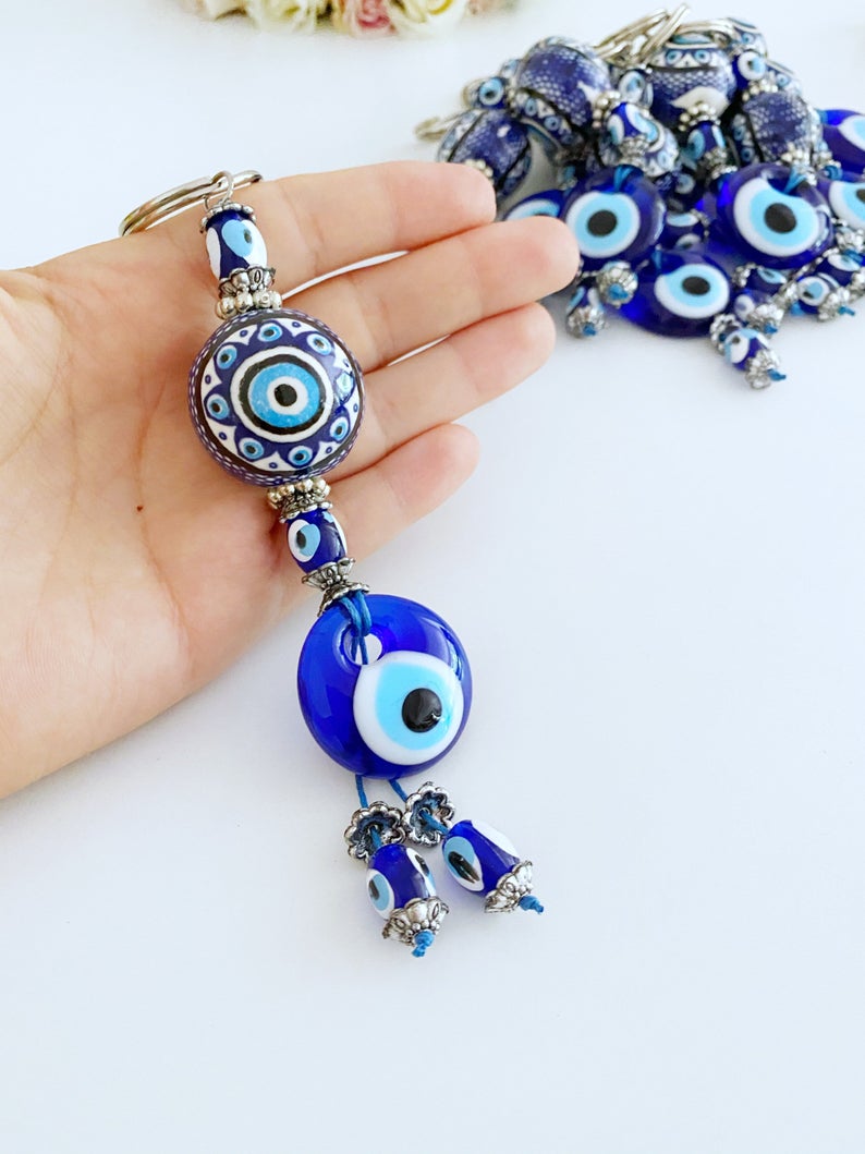 Blue Evil Eye Keychain featuring a ceramic ball charm and evil eye design, symbolizing protection and good luck.