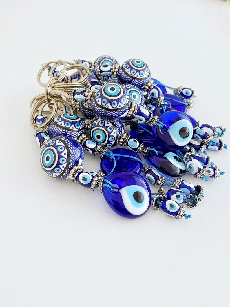 Blue Evil Eye Keychain featuring a ceramic ball charm and evil eye design, symbolizing protection and good luck.