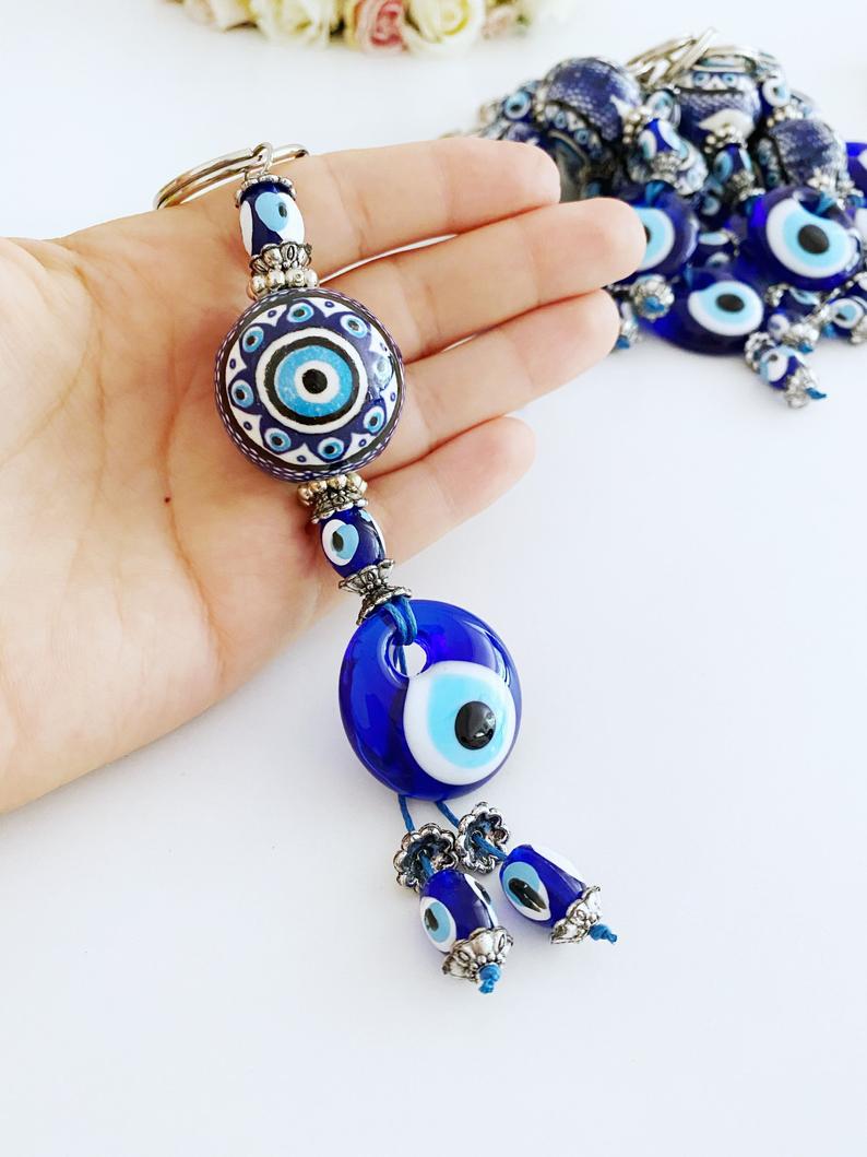 Blue Evil Eye Keychain featuring a ceramic ball charm and evil eye design, symbolizing protection and good luck.
