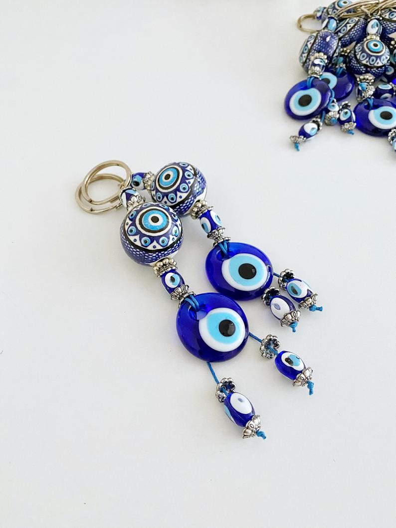 Blue Evil Eye Keychain featuring a ceramic ball charm and evil eye design, symbolizing protection and good luck.
