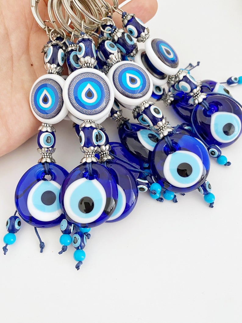 A beautiful Blue Evil Eye Keychain featuring a vibrant blue bead, symbolizing protection and luck, perfect for keys or bags.