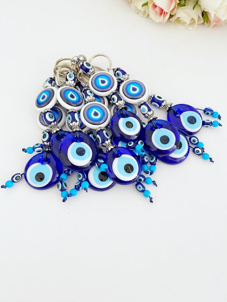 A beautiful Blue Evil Eye Keychain featuring a vibrant blue bead, symbolizing protection and luck, perfect for keys or bags.