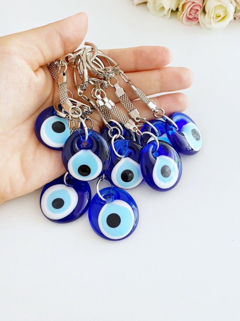 A beautiful Blue Evil Eye Keychain featuring a glass evil eye bead, measuring 10cm in total length, perfect for keys or bags.