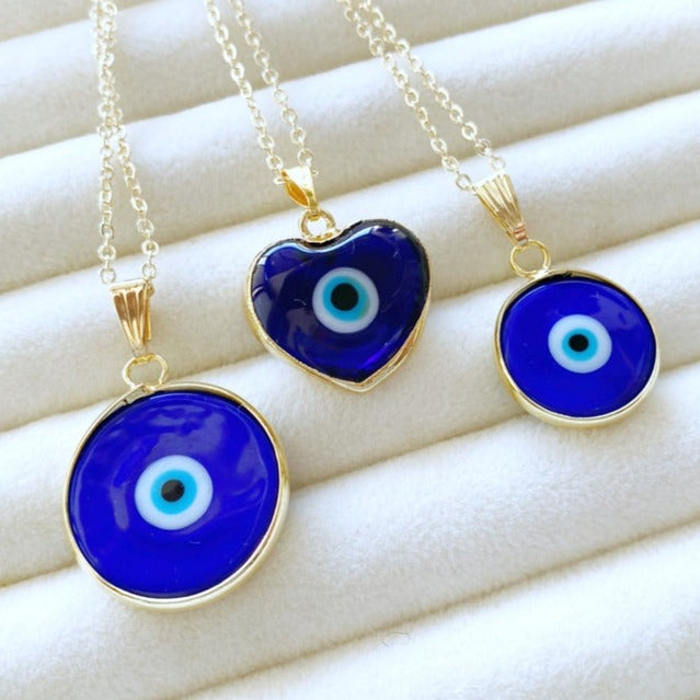A beautiful Blue Evil Eye Necklace featuring a Murano glass bead and a gold stainless steel chain, showcasing intricate craftsmanship.