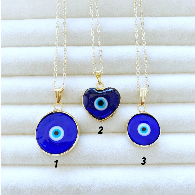 A beautiful Blue Evil Eye Necklace featuring a Murano glass bead and a gold stainless steel chain, showcasing intricate craftsmanship.