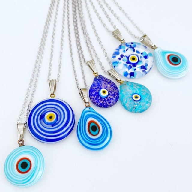 A beautiful Blue Evil Eye Necklace featuring handmade Murano glass beads and a silver chain, symbolizing protection and style.