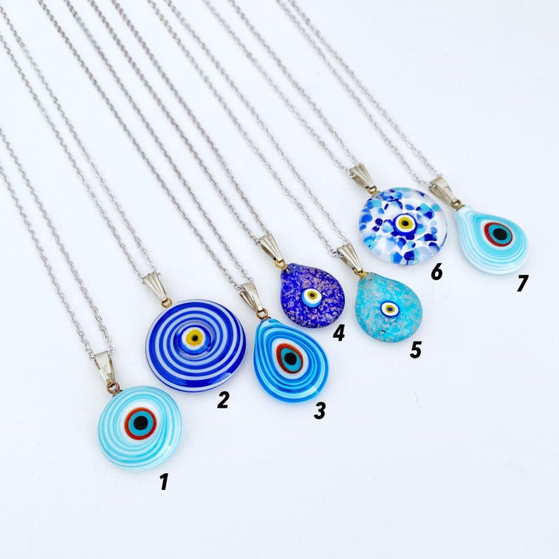 A beautiful Blue Evil Eye Necklace featuring handmade Murano glass beads and a silver chain, symbolizing protection and style.