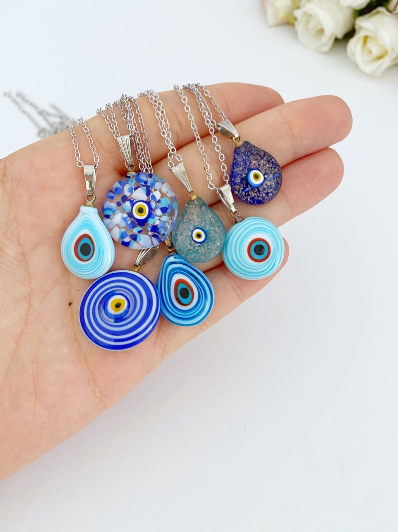 A beautiful Blue Evil Eye Necklace featuring handmade Murano glass beads and a silver chain, symbolizing protection and style.