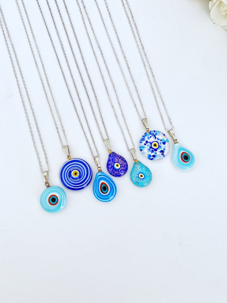 A beautiful Blue Evil Eye Necklace featuring handmade Murano glass beads and a silver chain, symbolizing protection and style.