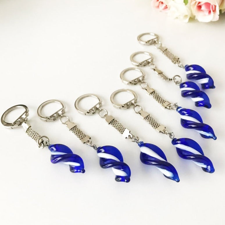 A beautiful blue glass keychain featuring a spiral glass bead and silver accents, perfect for keys or bags.