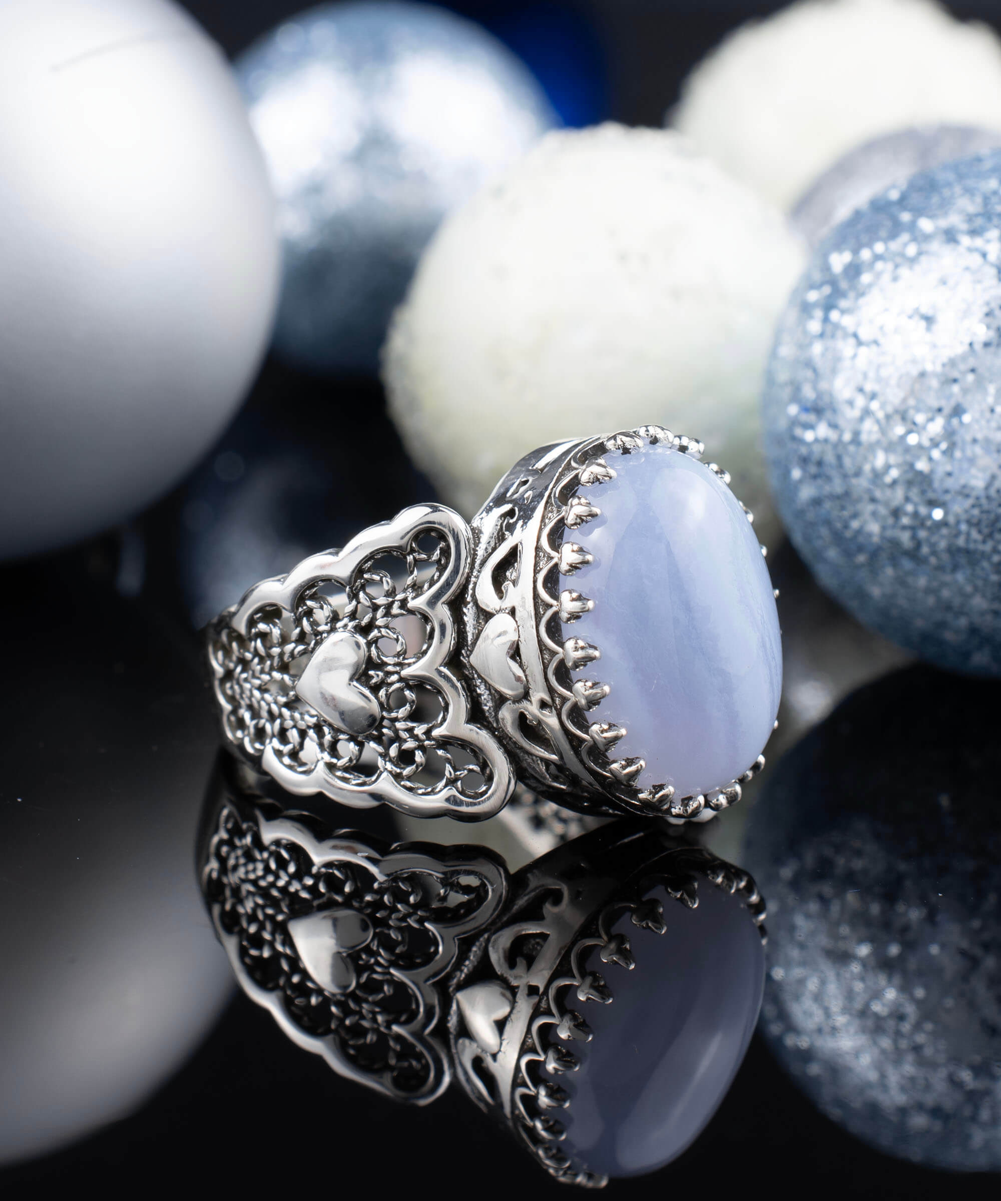 A beautiful Blue Lace Agate Gemstone Double Heart Ring made of 925 sterling silver with intricate filigree design.